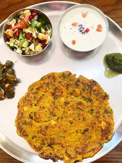 This is what a truly balanced and simple home-cooked meal looks like. My plate features a methi paneer roti, okra with peanuts, a fresh chickpea salad, and Greek yogurt. Healthy eating is about enjoying wholesome, flavorful food.