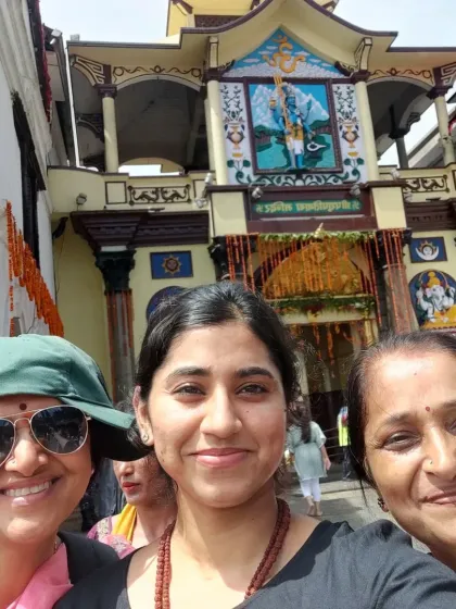A selfie of three happy pilgrims at Pashupatinath Temple, capturing the joy of being in such a holy place.