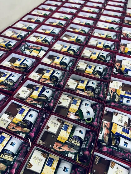 We excel at handling large corporate orders, like this one for Modiwave. Each gift box is carefully packed with branded mugs and a selection of gourmet treats, ensuring a consistent and high-quality brand experience for every recipient.