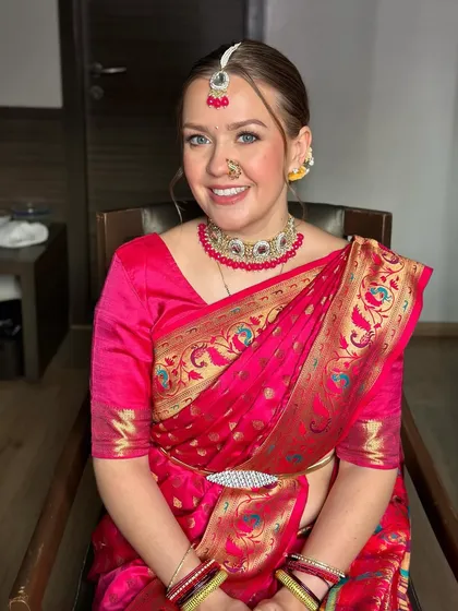 A close-up of my beautiful bride from abroad. Her blue eyes pop against the pink of the saree, and her makeup is fresh and radiant.