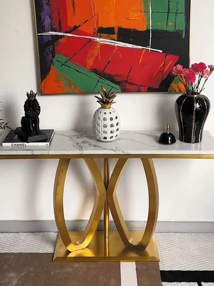 Here is our Solace Sanctuary console table styled with bold, monochrome decor. Its versatile design allows it to be a canvas for your personal style, whether you prefer colorful art or classic black and white accessories.