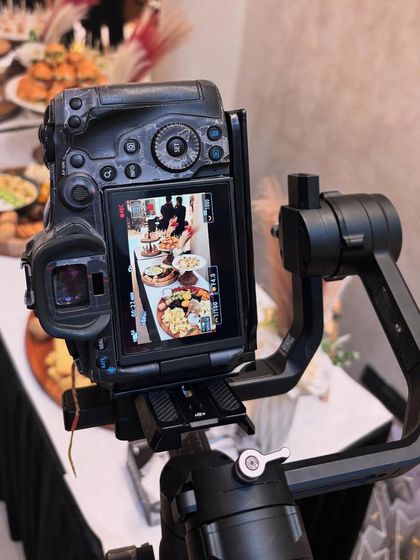 Behind the scenes at the Arte Salon event, with the camera focused on the beautifully arranged grazing table. Every angle is considered to get the perfect shot.