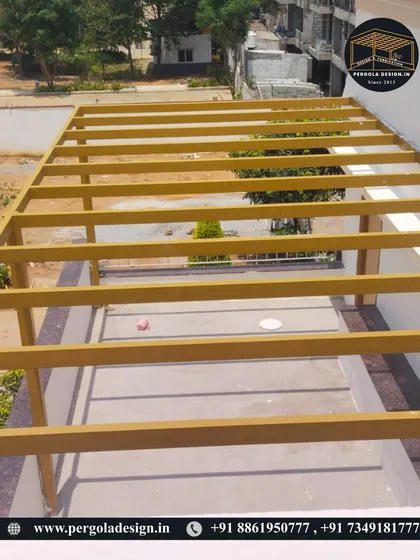An overhead view of the pergola framework under construction, showing the basic grid structure.