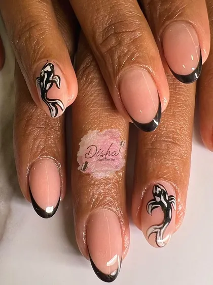 A unique take on the French manicure. This design features classic black tips with two accent nails showcasing beautifully hand-painted koi fish for a touch of artistic flair.