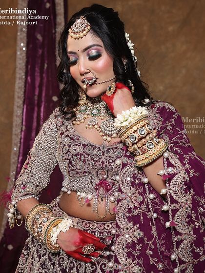 Learn to work with rich, royal color palettes like this deep purple. This look showcases dramatic eye makeup and perfectly coordinated styling for a regal bridal appearance.