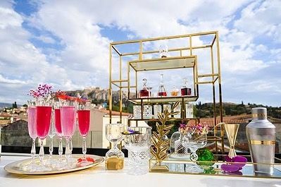 Another angle of the pink-themed destination wedding bar, showing the stunning view and the elegant gold-accented shelving we used. We believe the bar should be as beautiful as the location itself.