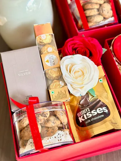 The perfect gift for your partner. This red-themed box includes chocochip cookies, a Zara mini perfume, Ferrero Rocher, and Hershey's Kisses.