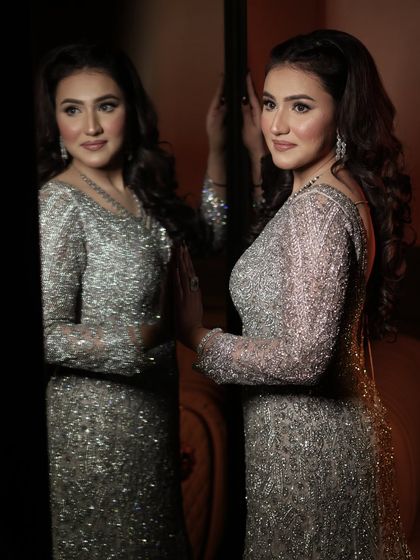 An unfiltered picture of my client looking stunning in a silver gown. The makeup is soft and glowing.