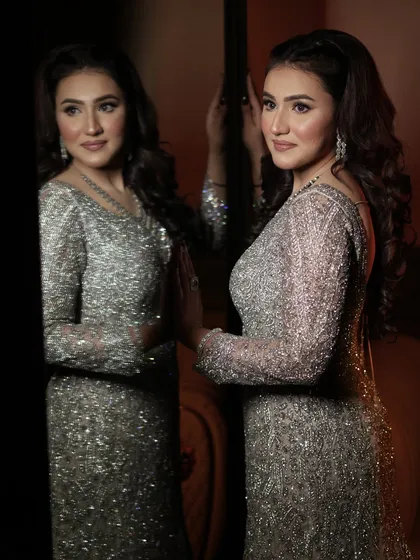 An unfiltered picture of my client looking stunning in a silver gown. The makeup is soft and glowing.