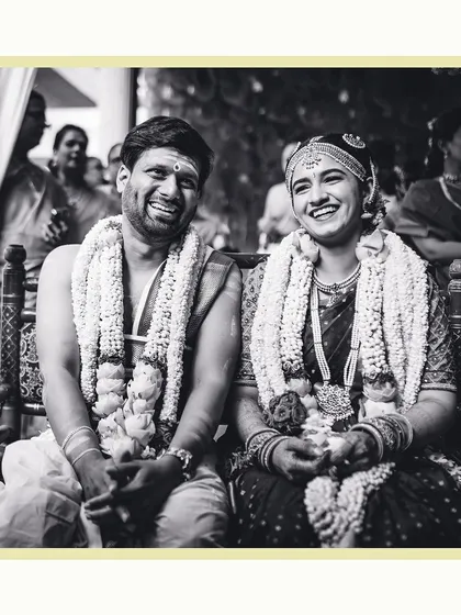 The purest smiles between a bride and groom during their wedding ceremony. We believe in capturing these unscripted, real moments in timeless black and white, focusing on the genuine connection you share.