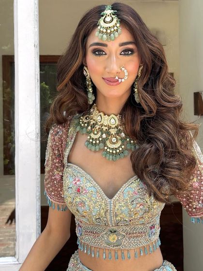 A close up of the bride's beautiful hair and makeup. The open hairstyle allows her to show off her long, healthy hair.