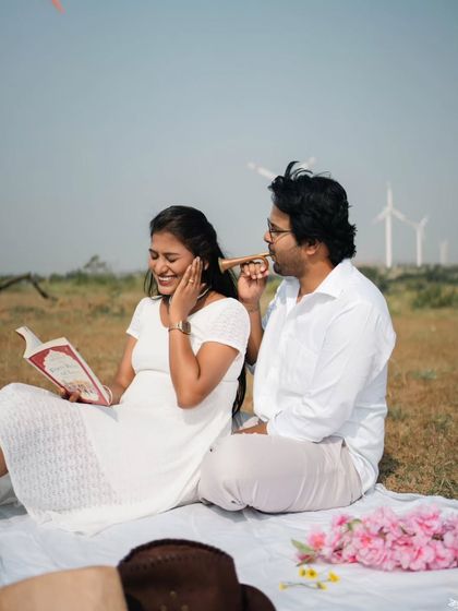 Sharing a lighthearted moment during their pre-wedding shoot, showing the fun and playful side of their relationship.