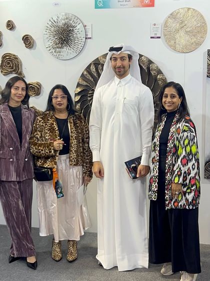 A group photo with visitors at my booth in Qatar. The event brought together so many people with a shared love for art.