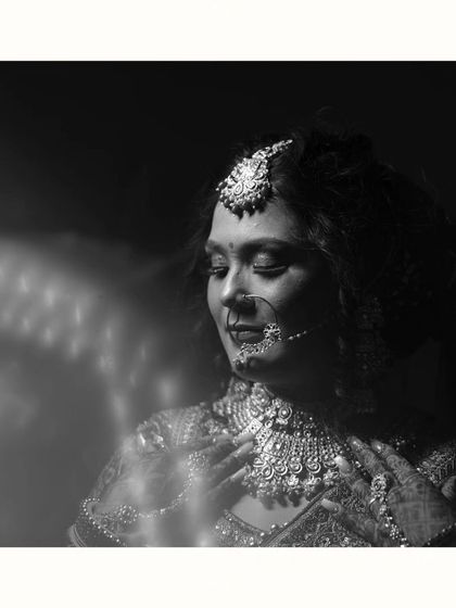 A timeless black and white portrait capturing a moment of quiet contemplation for the bride. The play of light and shadow adds depth and emotion to this artistic shot.