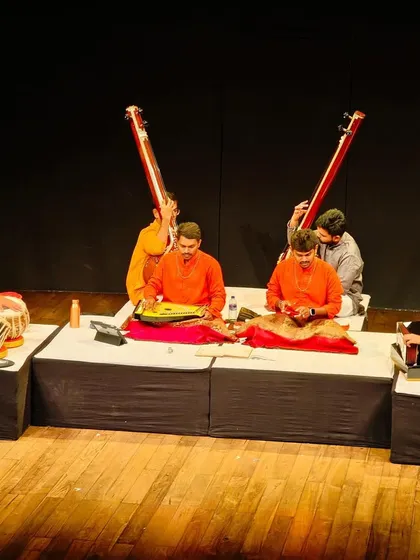 Another angle of the performance, capturing the synergy between the vocalists, harmonium player, and me on the tabla.
