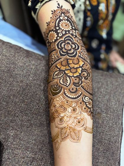 A close-up of the completed floral arm. The use of negative space and bold lines makes the flowers really stand out.