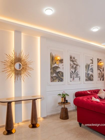 Detail shot of the console area in the Sobha Royal Pavilion project. The sunburst mirror and backlit wall panels add a layer of warmth and luxury, highlighting the neo-classical theme.