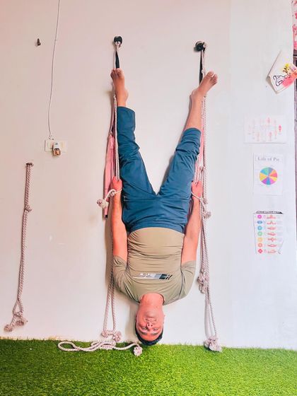 Another angle of the rope-assisted inversion. You can see how the ropes support the hips, making the pose accessible and deeply restorative for the whole body.