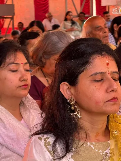 A moment of deep inner connection during the Maha Shivratri puja. Our celebrations are not just about external rituals, but about providing a space for everyone to turn inward and experience profound peace and meditation.