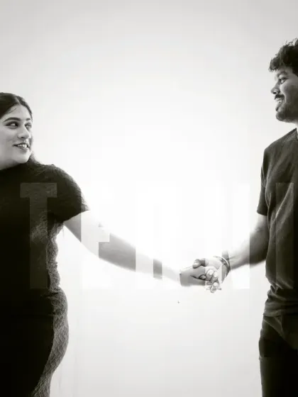 A stylish black and white shot perfect for an announcement. This image of a couple holding hands has a modern, graphic feel that is both artistic and personal.