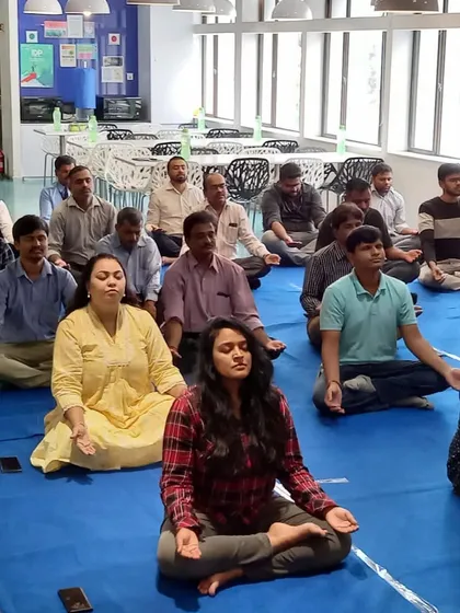 A few moments of guided meditation can completely change the energy in a room. Here, a team at Samsung takes a pause to quiet their minds. These simple techniques for employee stress reduction can be used anywhere, even at your desk.