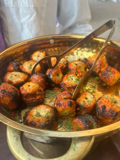 Tandoori Mushroom Tikka, fresh from the grill. These are marinated in spices and yogurt for a smoky, tangy flavor.