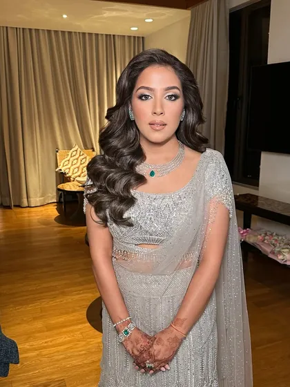 A full-length view of the cocktail look, where the big, beautiful hair is the star of the show.