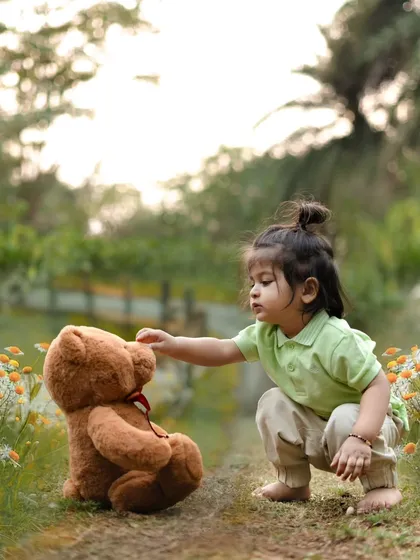 A tender moment between a little boy and his teddy bear. Outdoor settings provide a beautiful, natural canvas for these sweet, story-like photos.
