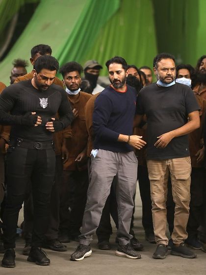 Reviewing a take on a green screen set for 'Bagheera'. This is where we combine physical stunt work with the potential for visual effects, planning every detail with the VFX team.