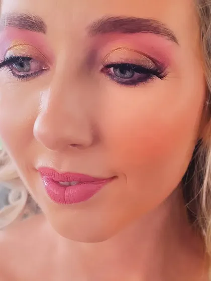 Another angle of this playful and glamorous party look. The skin is kept fresh and dewy to balance the bold eyes.