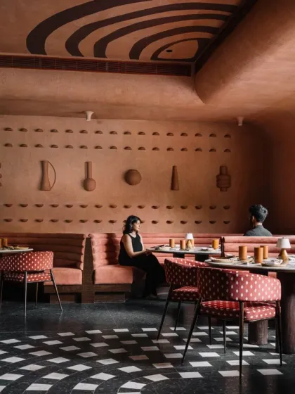 For the Idylll restaurant, we created an immersive, earth-toned environment reminiscent of a monolith rising from the ground. The design uses a tactile palette of lime plaster, patterned granite, and custom terracotta artifacts to build a narrative rooted in timeless Indian traditions.