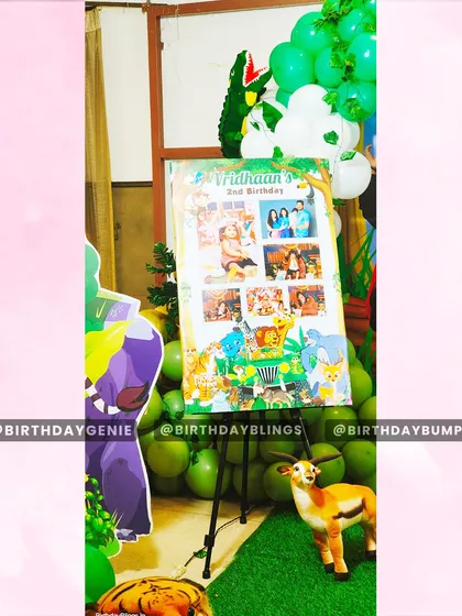 I often include a personalized photo collage board as part of the party decor. This one, for a jungle-themed second birthday, showcases memories from the past year.