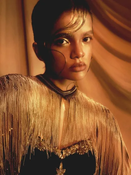 Creating a mood is key in editorial work. This golden, glossy look plays with light and texture to create something truly artistic and memorable, perfect for a high-concept fashion story.