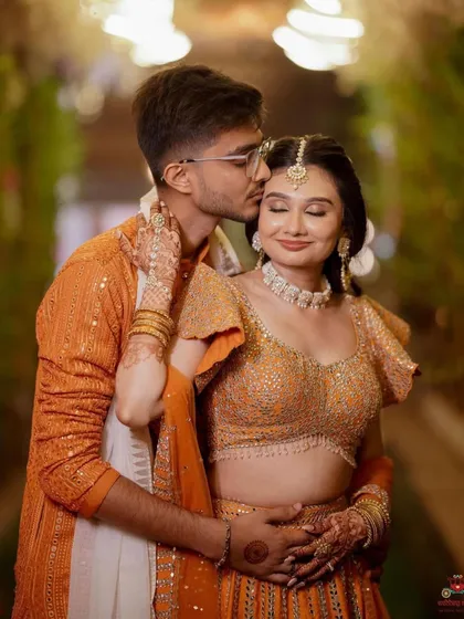 A romantic portrait from the Haldi event. The bride's makeup is soft and luminous, with a focus on her eyes that are sparkling with happiness.