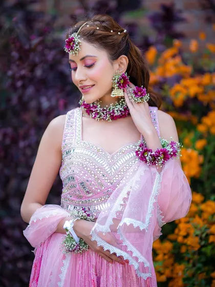 A beautiful portrait showing the intricate details of the floral jewellery and the complementary makeup.