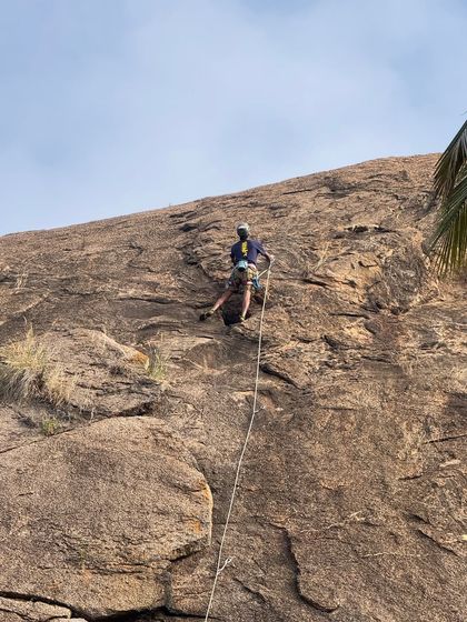 A closer shot of Raghava on the route, showing his focus and the gear used for this lead climb.