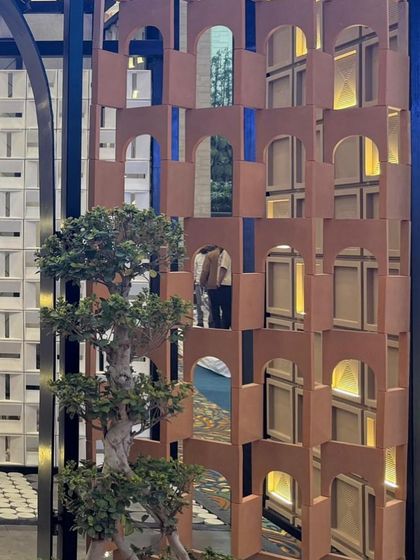 Our concrete *jaali* partitions used as a decorative screen. The intricate, repeating arch pattern adds a touch of elegance and sophistication while allowing light and air to pass through.