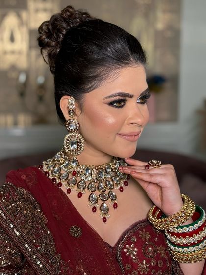 Another angle of this beautiful bride, showing the side view of her updo and the elegant way her jewelry sits.