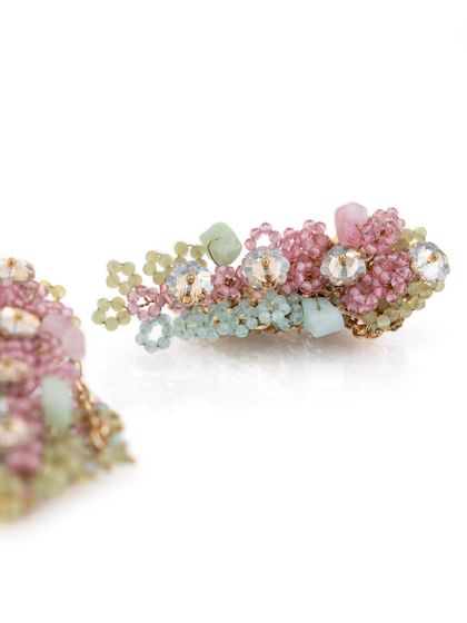 A detailed close-up of the semi-precious stones and crystals used in these handcrafted earrings.
