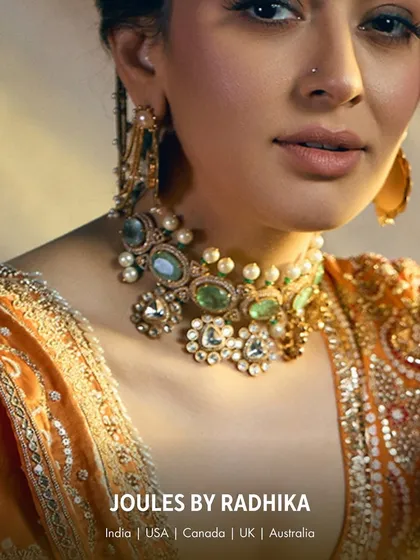 A close-up of the unique choker worn by Hansika Motwani, featuring a mix of polki, pearls, and pastel-colored stones for a distinctive look.