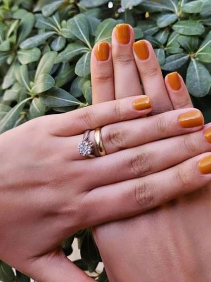 A warm, mustard yellow polish. This is a unique and fashionable color choice, perfect for autumn or for anyone who loves earthy tones.