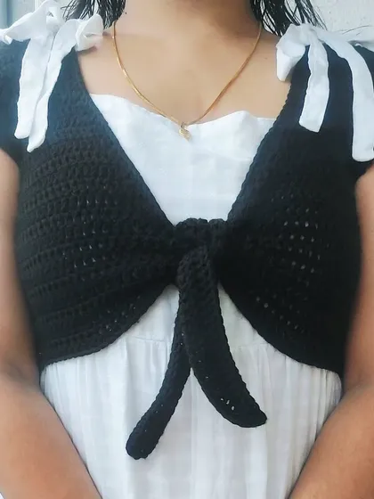 A close-up of the shoulder bows and the simple, elegant design of the Mari Top.