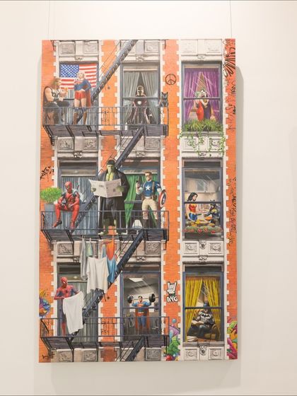 The full canvas of 'Ordinary Powers' by Sanuj B. This artwork transforms a city building into a vibrant tableau of superhero life, blending the extraordinary with the everyday.