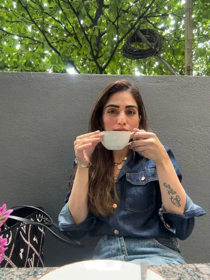 Enjoying every last drop. My denim shirt and simple jewelry make this a comfortable and casual moment.