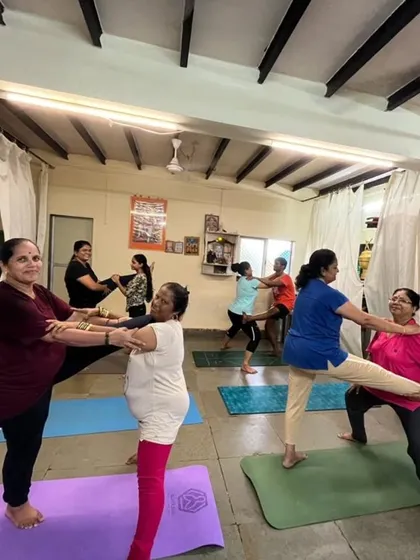 The joy of practicing together is unmatched. In my group classes, we often use partner work to build trust, support, and balance, proving that yoga has no age limit. It's all about finding energy and breathing together.