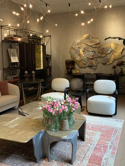 The Flock of Light showcased at a design event in Hyderabad, where its sculptural form is paired with high-end furniture and art, demonstrating its place in luxury interiors.