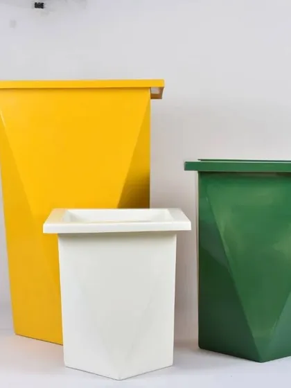 Brightly colored fiber planters in geometric shapes. These yellow, green, and white pots are perfect for adding a pop of color to your space.