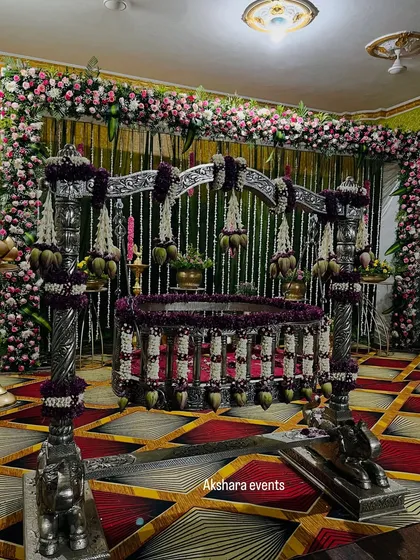 For a naming ceremony, the thottil (cradle) is the heart of the event. I adorn it with intricate floral arrangements, like these jasmine and lotus bud garlands on an ornate silver cradle, making it a beautiful centerpiece for welcoming your little one.