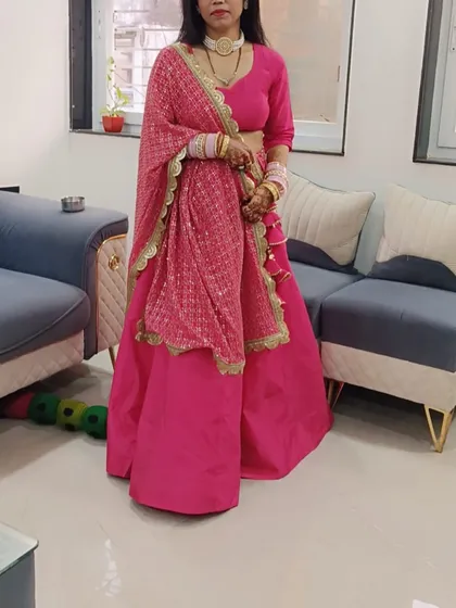A happy client in her custom-made pink lehenga. We designed this simple yet elegant outfit with a plain silk skirt and a beautifully embroidered dupatta for a balanced and graceful look.