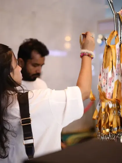 A visitor collects her delegate pass and lanyard, ready to explore the vast array of smart home technologies and connect with industry peers.